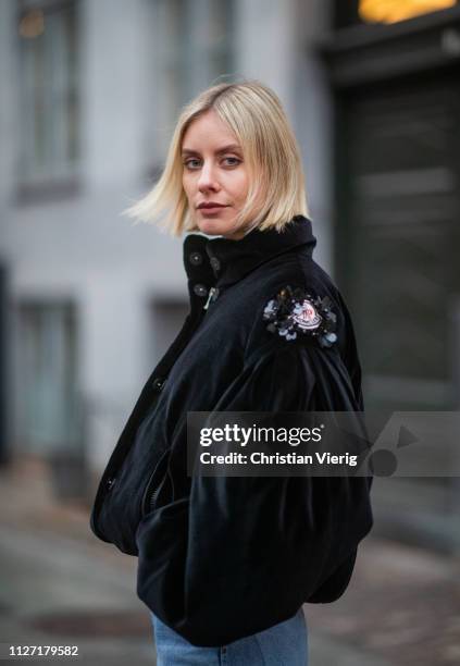 Lisa Hahnbueck is seen wearing black cropped Moncler jacket, denim jeans Goldsign during the Copenhagen Fashion Week Autumn/Winter 2019 - Day 3 on...