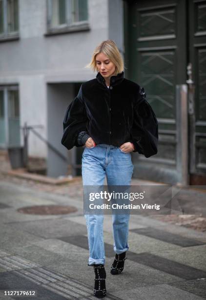 Lisa Hahnbueck is seen wearing black cropped Moncler jacket, denim jeans Goldsign, Jimmy Choo shoes during the Copenhagen Fashion Week Autumn/Winter...