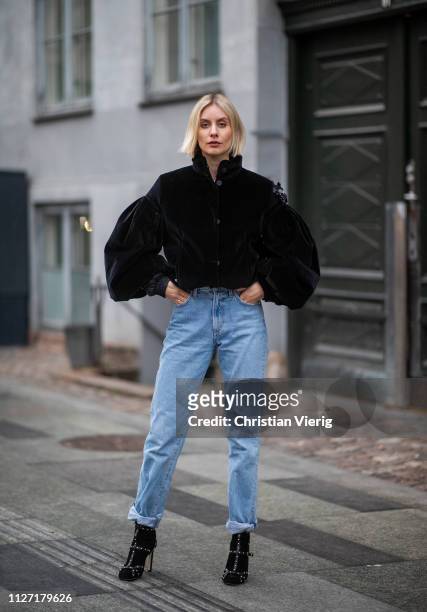 Lisa Hahnbueck is seen wearing black cropped Moncler jacket, denim jeans Goldsign, Jimmy Choo shoes during the Copenhagen Fashion Week Autumn/Winter...