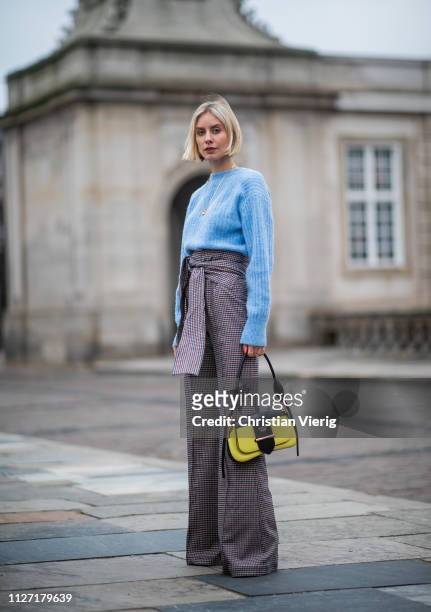 Lisa Hahnbueck is seen wearing blue &other stories knit, high waisted flared pants Silvia Tcherassi and Prada bag during the Copenhagen Fashion Week...