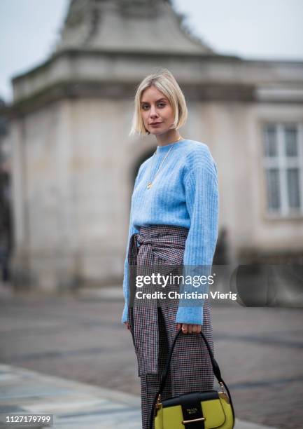 Lisa Hahnbueck is seen wearing blue &other stories knit, high waisted flared pants Silvia Tcherassi and Prada bag during the Copenhagen Fashion Week...