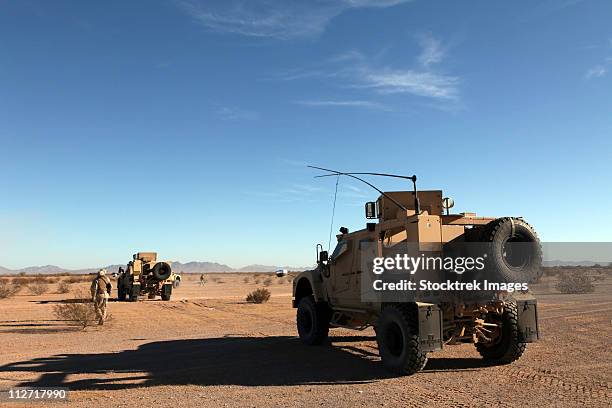 october 30, 2010 - u.s. marines ground guide mine resistant ambush protected all terrain vehicles (m-atv) at auxiliary airfield 6, luke air force base, arizona. - armored vehicle stock pictures, royalty-free photos & images