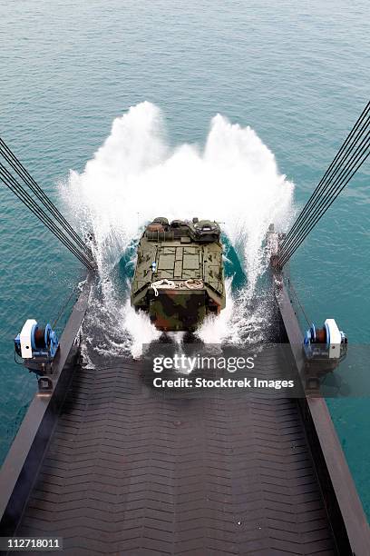 amphibious assault vehicles disembark from usns 1st lt jack lummus. - marine apc stock pictures, royalty-free photos & images