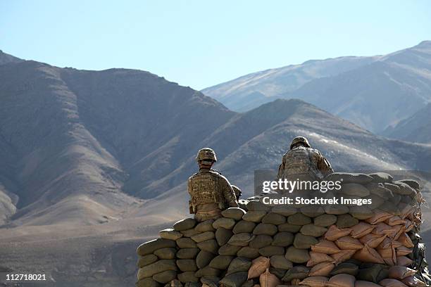 january 9, 2011 - u.s. army soldiers run communications equipment from a sandbag bunker in the daymirdad district center, wardak province, afghanistan. - military afghanistan stock pictures, royalty-free photos & images