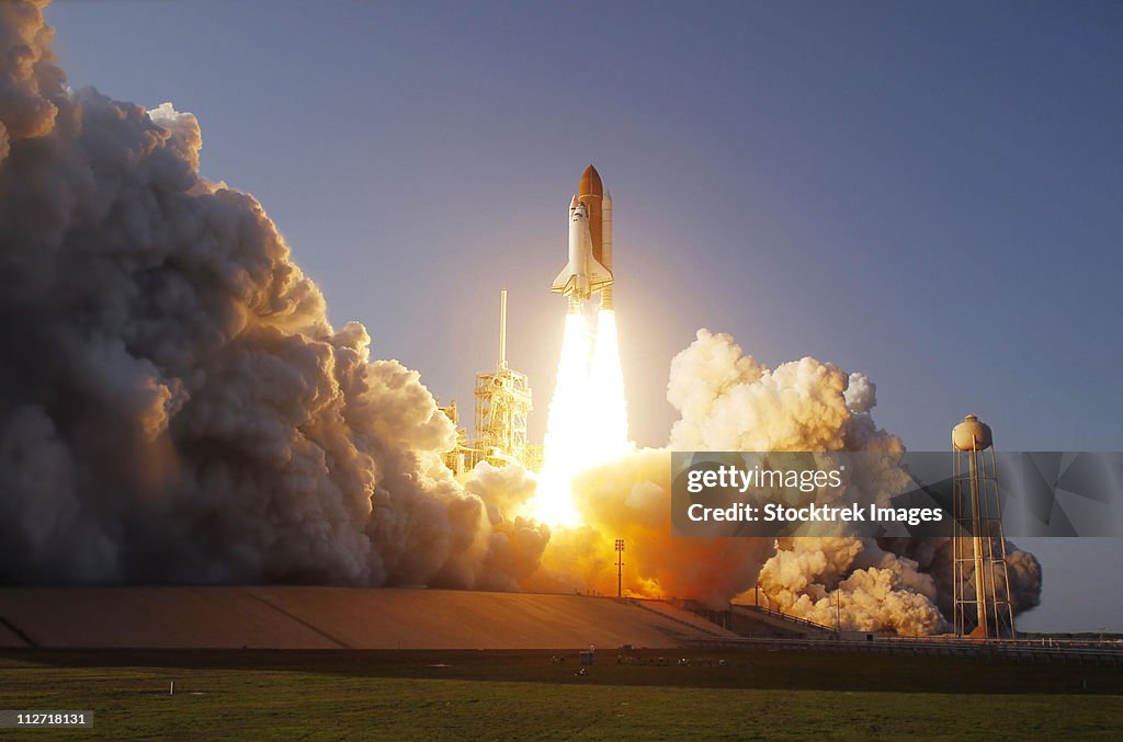 Space Shuttle Discovery lifts off from its launch pad at Kennedy Space Center, Florida.