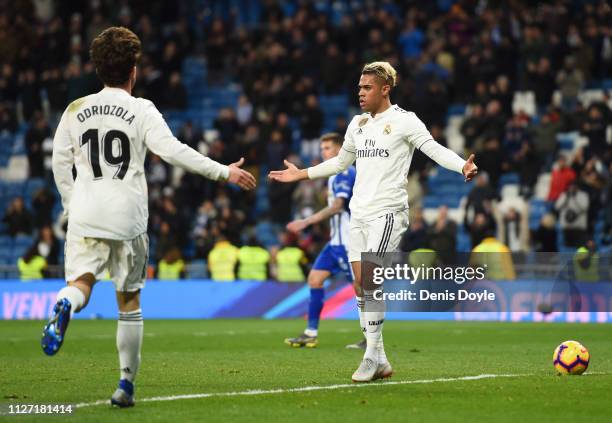 Mariano of Real Madrid celebrates after scoring his team's third goal with Alvaro Odriozola during the La Liga match between Real Madrid CF and...