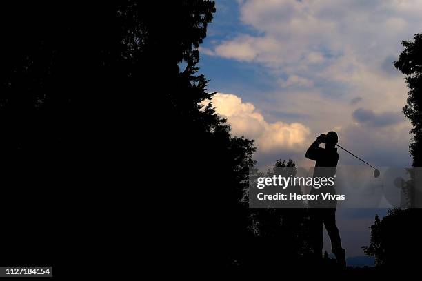 Tiger Woods of United States plays his shot on the 11th hole during the final round of World Golf Championships-Mexico Championship at Club de Golf...