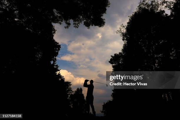 Tiger Woods of United States plays his shot on the 11th hole during the final round of World Golf Championships-Mexico Championship at Club de Golf...