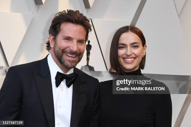 Best Actor nominee for "A Star is Born" Bradley Cooper and his wife Russian model Irina Shayk arrive for the 91st Annual Academy Awards at the Dolby...