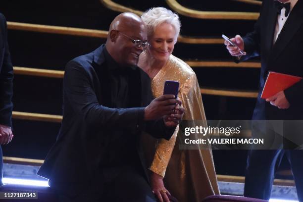 Actress Glenn Close and actor Samuel L. Jackson do a selfie as they arrive at the 91st Annual Academy Awards at the Dolby Theatre in Hollywood,...