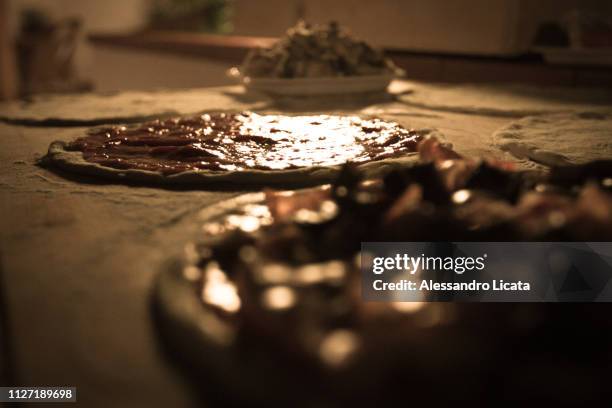 pizza preparation - sezione parziale stock pictures, royalty-free photos & images