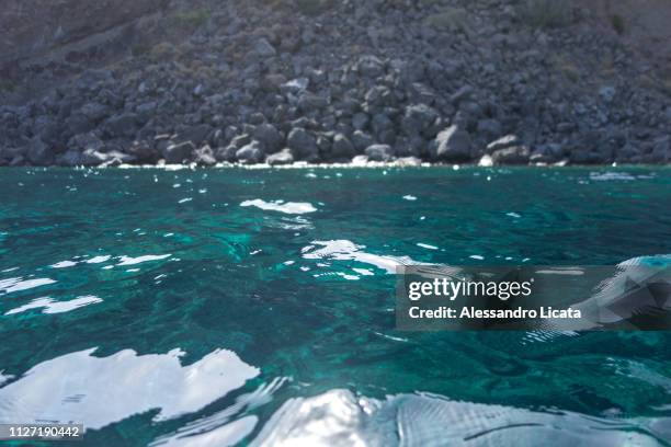 clear sea and rock - idillio stock pictures, royalty-free photos & images