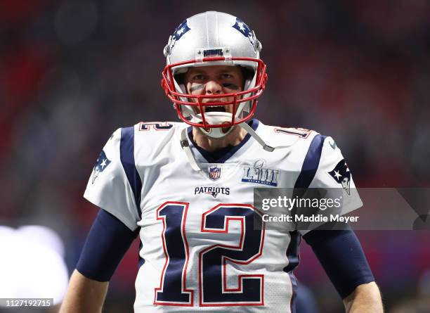 Tom Brady of the New England Patriots runs out on to the field prior to Super Bowl LIII against the Los Angeles Rams at Mercedes-Benz Stadium on...