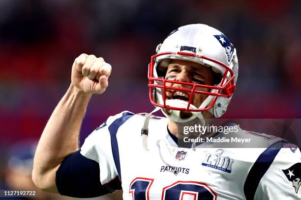 Tom Brady of the New England Patriots runs out on to the field prior to Super Bowl LIII against the Los Angeles Rams at Mercedes-Benz Stadium on...