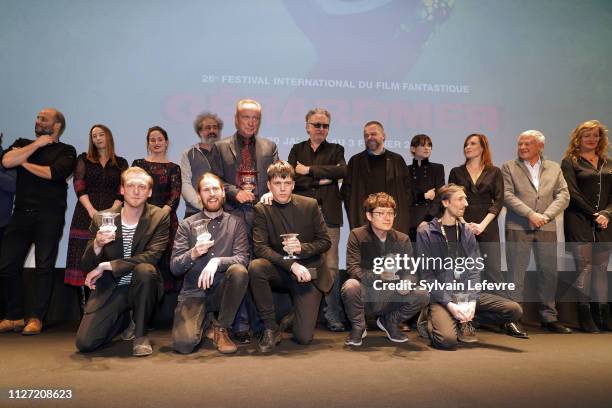 Albin Pettersson, Udo Kier, Olle Tholen, Christoffer Nordenrot, Mathieu Megemont and Park Hoon-Jung pose with their awards and with jury members...
