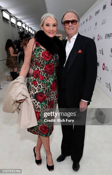 Margaret DeVogelaere and Peter Fonda attend the 27th annual Elton John AIDS Foundation Academy Awards Viewing Party sponsored by IMDb and Neuro...