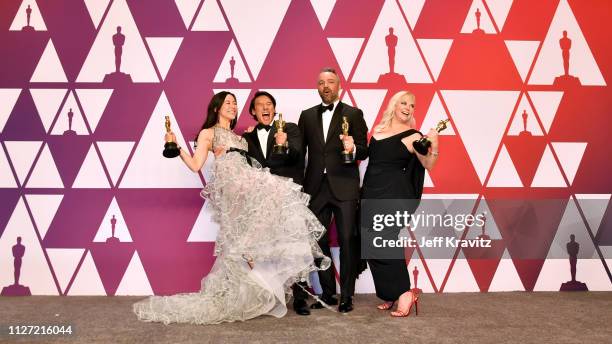 Elizabeth Chai Vasarhelyi, Jimmy Chin, Evan Hayes, and Shannon Dill, winners of Best Documentary Feature for 'Free Solo,' pose in the press room...