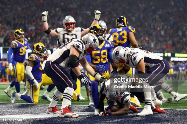 Sony Michel of the New England Patriots scores a touchdown against the Los Angeles Rams in the fourth quarter during Super Bowl LIII at Mercedes-Benz...