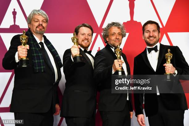 Ian Hunter, J.D. Schwalm, Paul Lambert, and Tristan Myles, winners of Best Visual Effects for 'First Man' pose in the press room during at Hollywood...