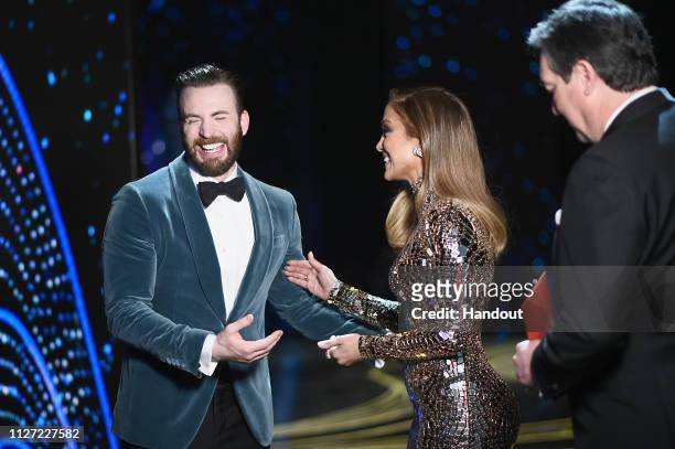 In this handout provided by A.M.P.A.S., presenters Chris Evans and Jennifer Lopez pose backstage during the 91st Annual Academy Awards at the Dolby...