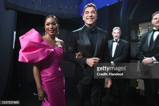 In this handout provided by A.M.P.A.S., Angela Bassett and Javier Bardem pose backstage during the 91st Annual Academy Awards at the Dolby Theatre on...