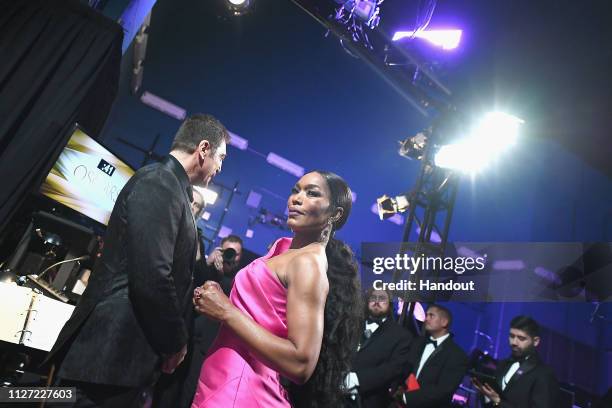 In this handout provided by A.M.P.A.S., Javier Bardem and Angela Bassett pose backstage during the 91st Annual Academy Awards at the Dolby Theatre on...