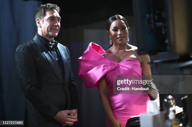 In this handout provided by A.M.P.A.S., Javier Bardem and Angela Bassett pose backstage during the 91st Annual Academy Awards at the Dolby Theatre on...