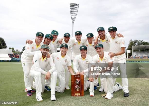 Australia celebrate with the trophy during day four of the Second Test match between Australia and Sri Lanka at Manuka Oval on February 04, 2019 in...