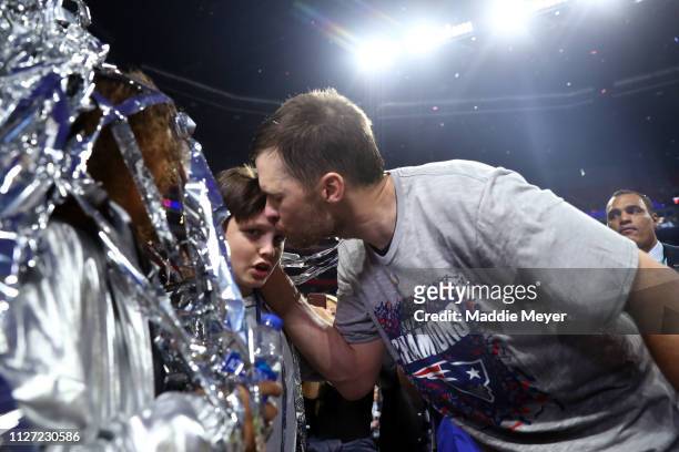 Tom Brady of the New England Patriots celebrates with John Edward Thomas Moynahan after his teams 13-3 win over the Los Angeles Rams during Super...