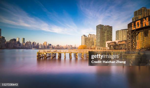 iconic gantries of gantry state park and buildings - long island city stock pictures, royalty-free photos & images