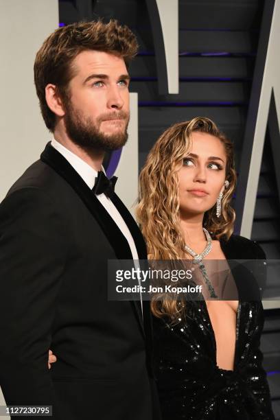 Liam Hemsworth and Miley Cyrus attend the 2019 Vanity Fair Oscar Party hosted by Radhika Jones at Wallis Annenberg Center for the Performing Arts on...
