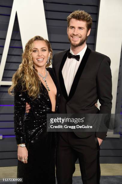 Liam Hemsworth and Miley Cyrus attend the 2019 Vanity Fair Oscar Party hosted by Radhika Jones at Wallis Annenberg Center for the Performing Arts on...