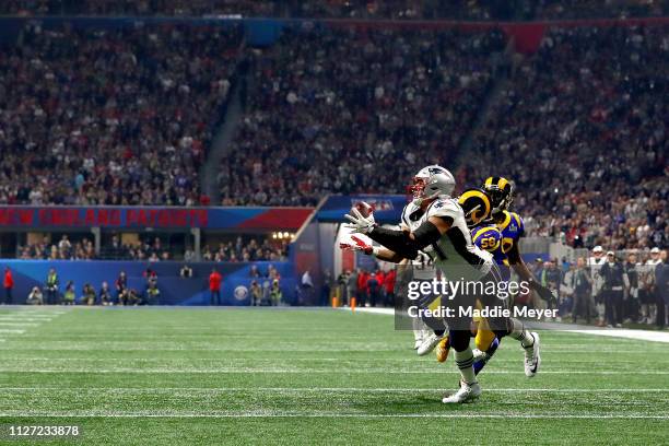 Rob Gronkowski of the New England Patriots catches a 29-yard reception in the fourth quarter against the Los Angeles Rams during Super Bowl LIII at...