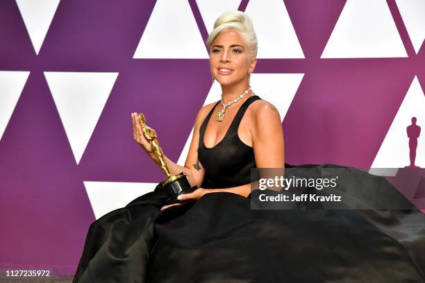 Lady Gaga poses with the Best Original Song award for "Shallow" in the press room during at Hollywood and Highland on February 24, 2019 in Hollywood,...