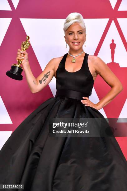 Lady Gaga poses with the Best Original Song award for "Shallow" in the press room during at Hollywood and Highland on February 24, 2019 in Hollywood,...