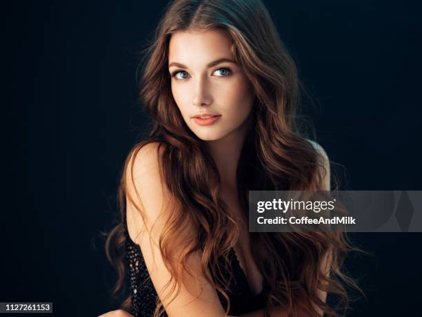 ? young beautiful model with long wavy well groomed hair - wavy hair imagens e fotografias de stock