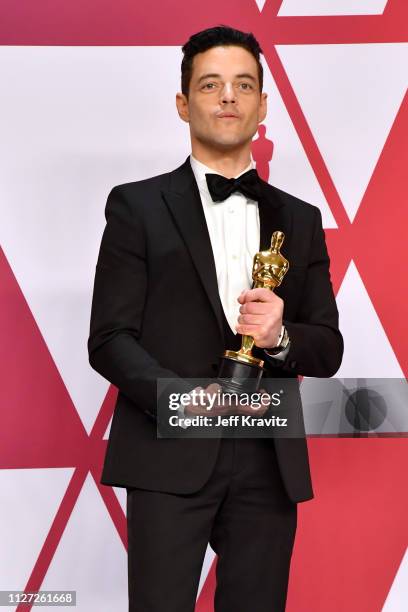 Rami Malek poses with the Best Actor award for "Bohemian Rhapsody" in the press room during at Hollywood and Highland on February 24, 2019 in...