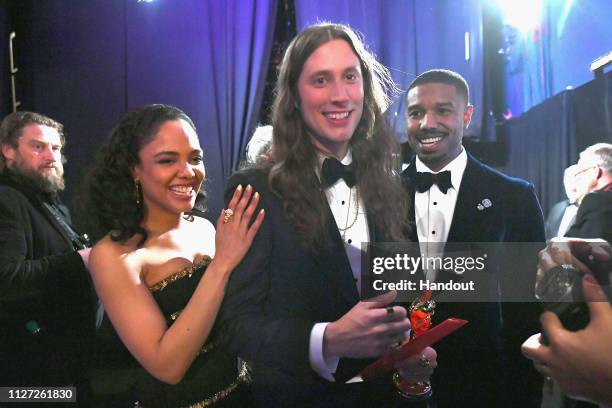 In this handout provided by A.M.P.A.S., Presenters Tessa Thompson and Michael B. Jordan pose backstage after presenting the Best Original Score award...