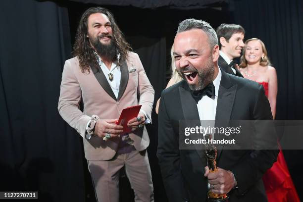 In this handout provided by A.M.P.A.S., Evan Hayes reacts backstage after winning the Best Documentary Feature award for "Free Solo" as presenter...