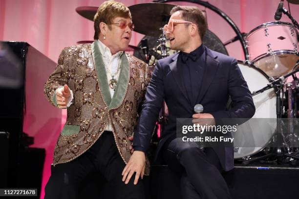 Sir Elton John and Taron Egerton perform onstage during the 27th annual Elton John AIDS Foundation Academy Awards Viewing Party sponsored by IMDb and...