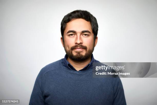 portrait of confident man against white background - mustache isolated stock-fotos und bilder