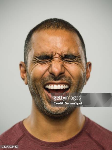 real pakistani man with excited expression and eyes closed - exhilaration imagens e fotografias de stock