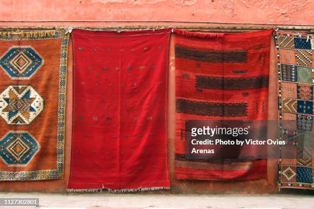 traditional hand made carpets for sale in the medina of marrakech, morocco - tapestry stock pictures, royalty-free photos & images