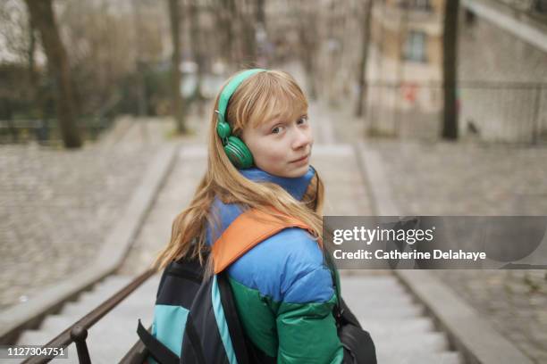 a 12 years old girl in the streets of paris - 12 13 years old girls imagens e fotografias de stock