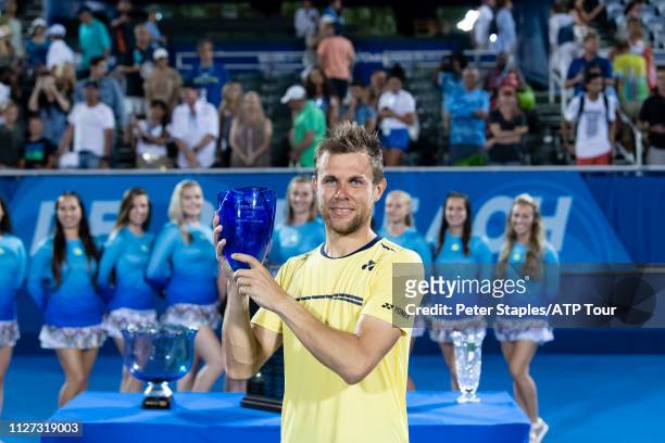 Finals champion Radu Albot of Moldova poses with the trophy after defeating Daniel Evans of Great Britain at the Delray Beach Open held at the Delray...