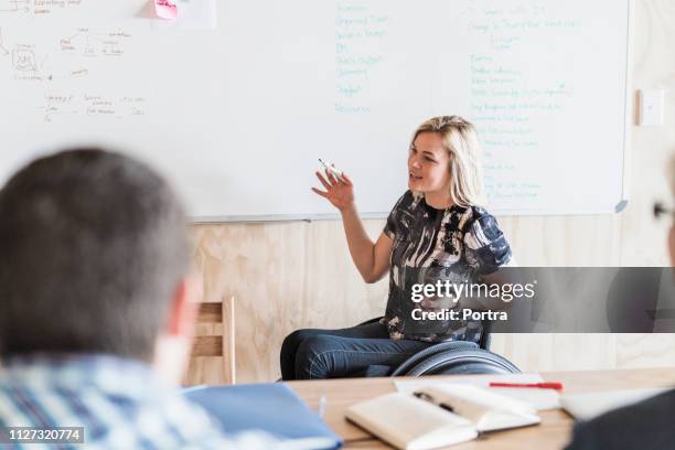 disabled businesswoman giving presentation - wheelchair office stock pictures, royalty-free photos & images