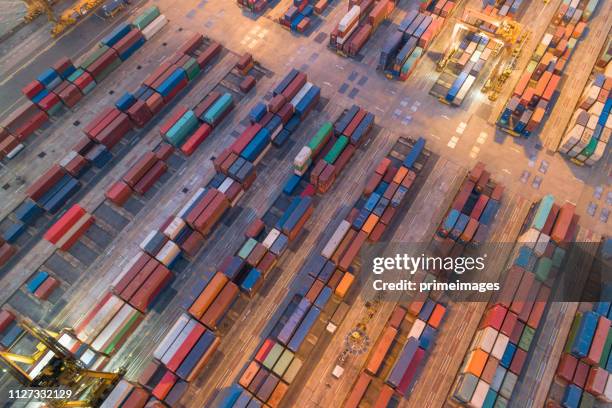 logistics and transportation of container cargo ship and cargo working crane bridge in shipyard - us china stock pictures, royalty-free photos & images