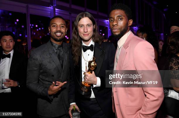 Michael B. Jordan, Composer Ludwig Goransson, winner Best Original Score for 'Black Panther' and Chadwick Boseman attend the 2019 Vanity Fair Oscar...