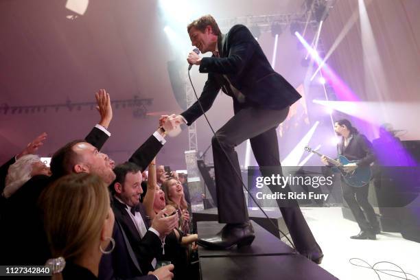 Brandon Flowers of The Killers performs onstage during the 27th annual Elton John AIDS Foundation Academy Awards Viewing Party sponsored by IMDb and...