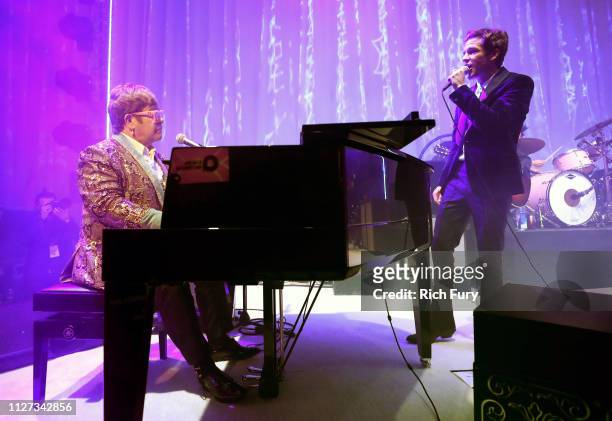 Sir Elton John and Brandon Flowers of The Killers perform onstage during the 27th annual Elton John AIDS Foundation Academy Awards Viewing Party...